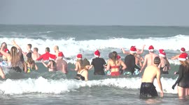 Boxing Day swimmers take to a chilly sea in Cornwall