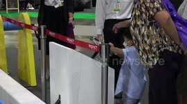 Kids turns crank set to set off elaborate chain reaction at science fair