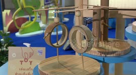 Handmade carved wooden toys displayed at science fair in Thailand