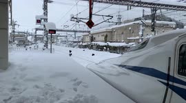 Record snowfall disrupts railways in western Japan including famous bullet trains