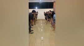 Friends play amusing holiday game during Christmas party in the Philippines