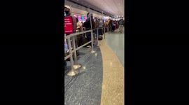 US: Travelers Line Up At Airports As Flight Cancellations Continue