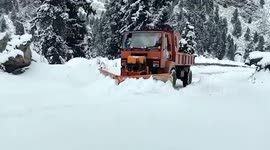 Local authorities carry out snow clearing operations in northern India