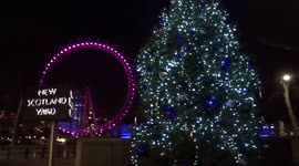 New Scotland Yard Christmas tree shines against the backdrop of the London Eye