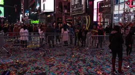 New Year's Eve aftermath in Times Square: Revelers depart and sanitation workers begin clearing confetti