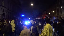 Police vehicle with lights and sirens on at Parliament Square as crowds greet New Year 2022