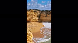 Portugal, Albufeira Praia das Salamitras, birds flying from the beach