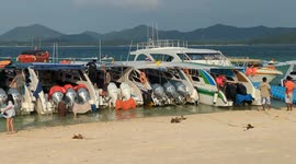 Dozens of speedboats in line on the beach of the island of of Khai Nai, near Phuket, thailand