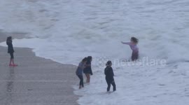 Huge numbers of visitors visit Newquay for the holiday, Very big seas catch out the unwary and the thrill seekers at Fistral Beach Cornwall UK