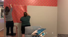 Time lapse video of us gift wrapping a 10 foot wall