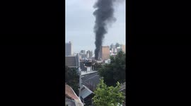 Column of smoke and fire at South African Parliament in Cape Town