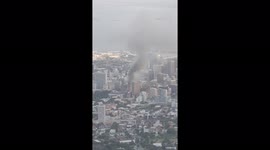 View of South African Parliament fire from Table Mountain, Cape Town