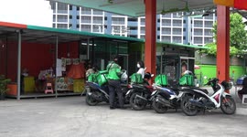Food delivery motorcycle riders collect orders in Bangkok, Thailand
