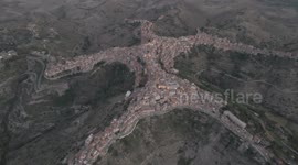 Man about town! Spectacular drone footage of Italian village reveals human shape