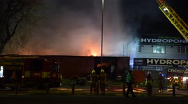 Blaze erupts in East London warehouse next to Charlie Brown's roundabout