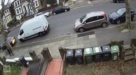 This is the moment a delivery driver appears to dump parcels on a roadside - which were meant as Christmas gifts