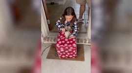 Adorable moment seven-year-old girl unwraps a puppy for Christmas
