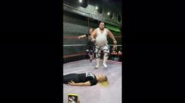 The wrestler performed an impressive trick on the girl