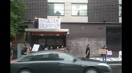 Protesters gather outside hotel where tennis star Novak Djokovic is detained