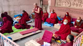Buddhist monks pray outside Mahabodhi temple for end of Omicron