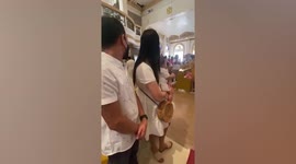 Baby appears to pray during baptism mass in the Philippines