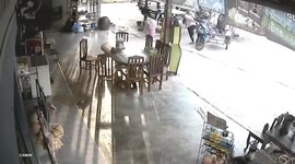 Shopkeeper shows quick reactions to dodge truck hurtling towards her