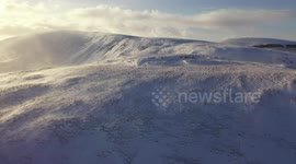 Drone Captures Dramatic Blowing Snow over N. Ireland Mountain - Clip 2
