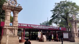 Monks and Tibetan devotees pray at the Mahabodhi Temple