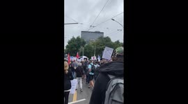 Anti-Vaxxers march through Melbourne to show support for Djokovic