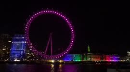 Rainbow of lights of the London Eye and the County Hall on the South Bank