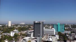 Builders working on the roof of the Melia Hotel in Chiang Mai, Thailand