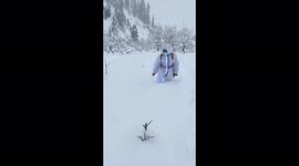 Medics wade through chest-deep snow to vaccinate villagers in northern India