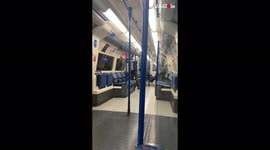 Man spotted removing 'face mask' posters from London tube carriage