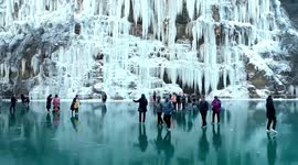 Tourists flock to get glimpse of stunning frozen waterfalls on mountains in China