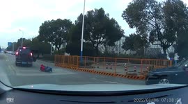 Child falls out of moving car as door swings open on road in China