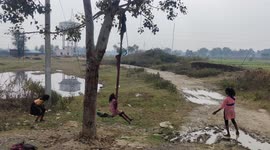 Funny Village tiny girls played high jump by tree in Northern India