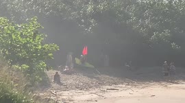 Defeated big wave surfer with broken board at Waimea bay hawaii