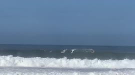 Big wave surfer Oahu hawaii Waimea bay, giant waves, wipe out