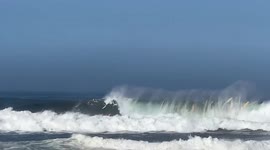 Big wave at Waimea bay, surfboards flying through the air, wipe out, Oahu, hawaii