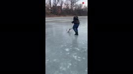 'Playful dog having a blast playing and running on ice'