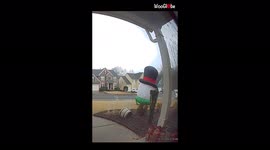 'Frosty the inflatable snowman takes flight on a windy day & gives its owner a run for her money '