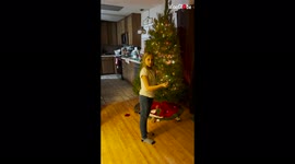 'Toddler slips and falls on floor while decorating Christmas tree *Try Not to Laugh*'