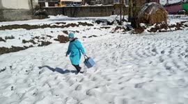 Healthcare workers hike through snow to vaccinate locals against Covid-19 in Kashmir