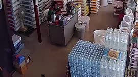Cat chases snake under shocked owner’s table in a warehouse in Thailand