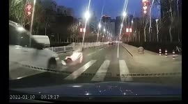 Car runs over Chinese woman after she slips over when crossing road