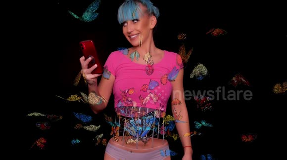 Makeup artist illustrates 'butterfly' feeling by painting winged insects on her stomach