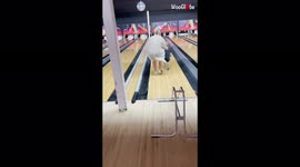 Mum slips and falls while running after son down bowling lane