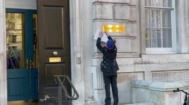 Protester hangs very rude sign outside Cabinet Office in London as Boris Johnson faces calls to quit