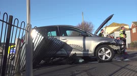 Car Crashes Through Car Park Railings Weymouth Dorset UK Police And Fire Fighters Attended As Two Elderly People Were Treated