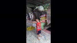 The 4-year-old boy holds a sword in his mouth and spins the ball above
